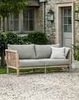 2 Seater Outdoor Sofa with cushions in patio garden.