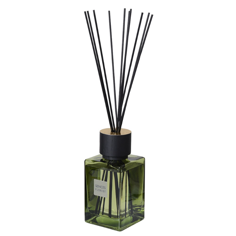 Sences Florist Reed Diffuser in green bottle against white background.