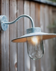 Shirley Outdoor Wall Light - Galvanised Steel on wooden wall.