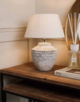Small grey distressed lamp with diffuser.