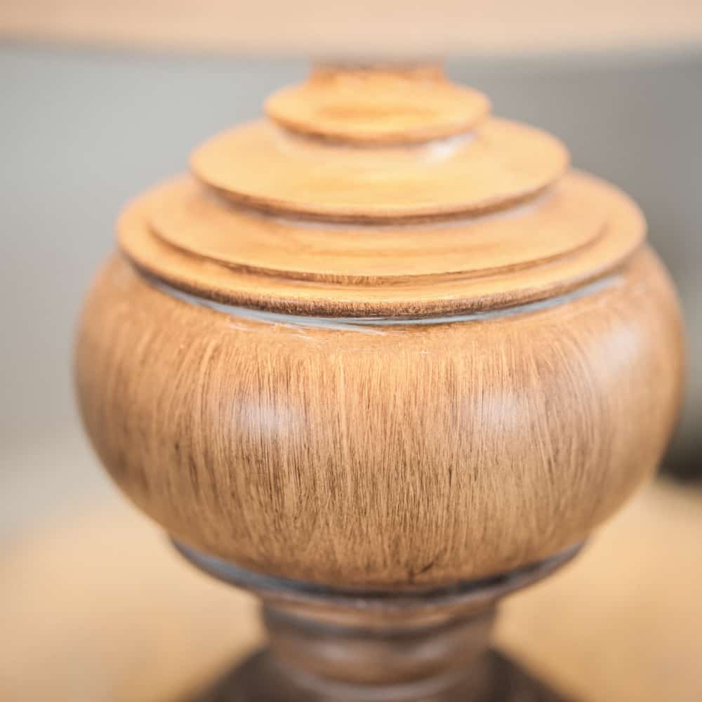Close up of wooden lamp base.