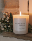 Wildflowers and Salt Soy Candle on a stone windowsill.