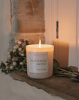 Wildflowers and Salt Soy Candle on a stone windowsill.
