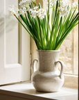 Wilma Ceramic Vase on windowsill with fresh stems on stone windowsill.
