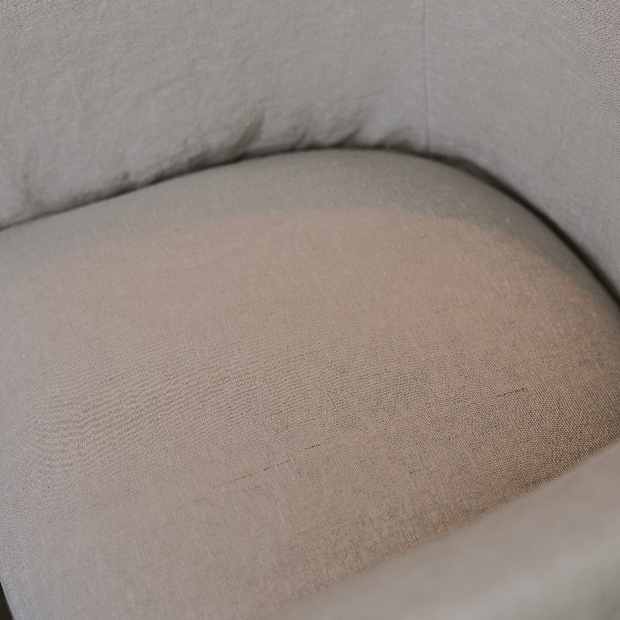 Detailed shot of linen dining chair.