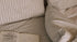 Striped cosy bedding with open book.