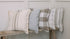 Line of patterned cushions on bench.