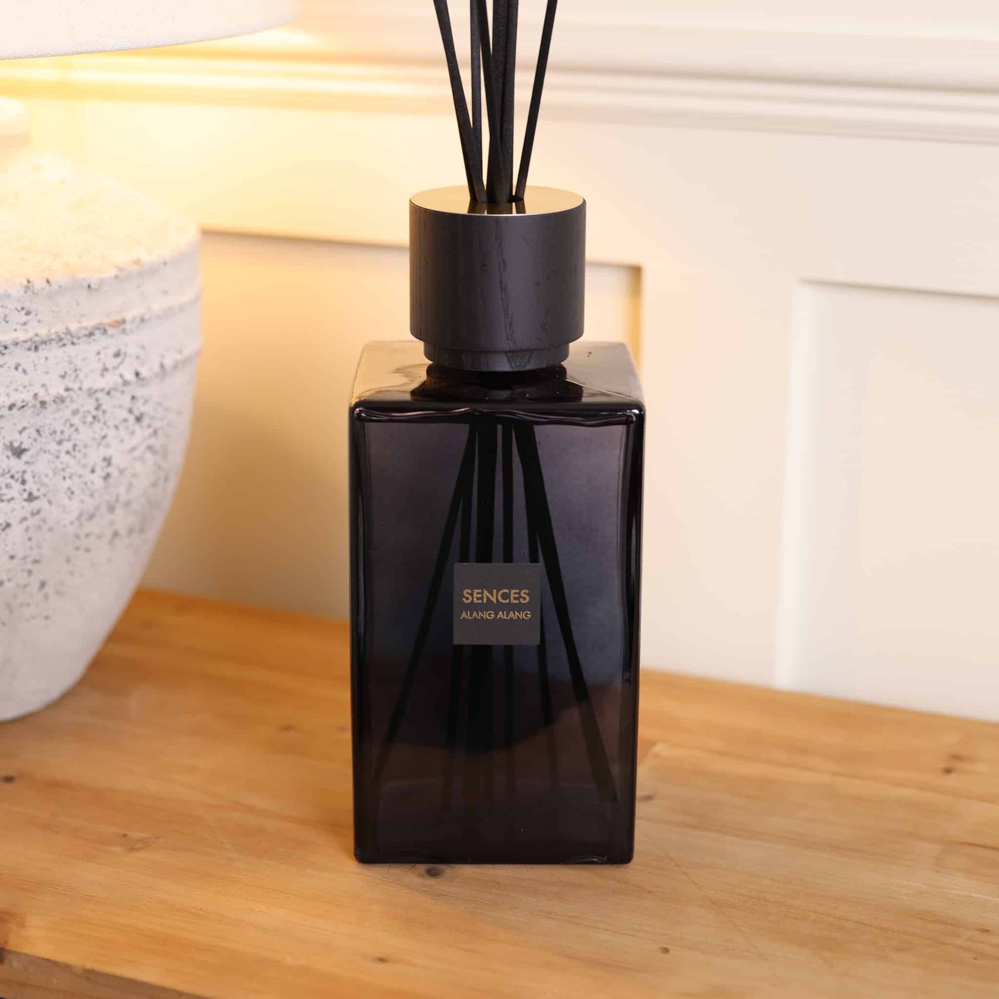 Sences Alang Alang Onyx Extra Large Reed Diffuser on wooden console styled with lamp