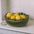 ceramic green bobble bowl with lemons.