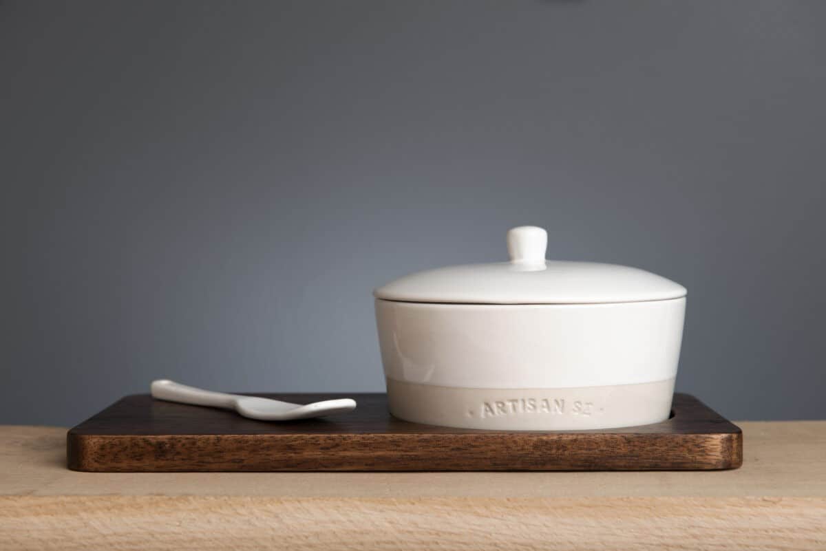  Stoneware Cheese Baker Set on wooden paddle.