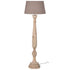 Tall wooden floor lamp with linen shade.