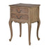 Reclaimed wood beside table with two drawers closed.