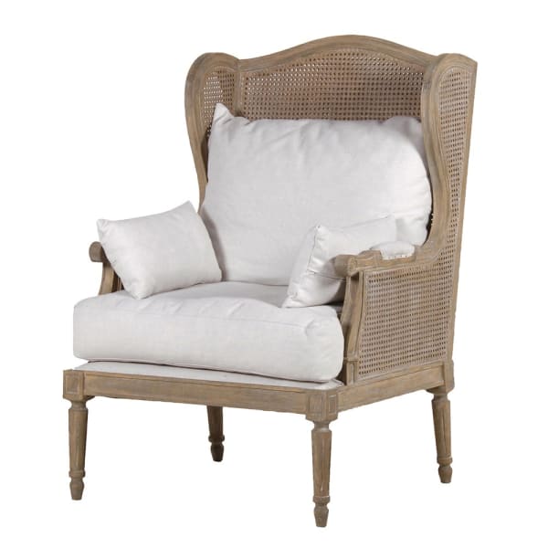 Oak bergere chair with cream cushions.