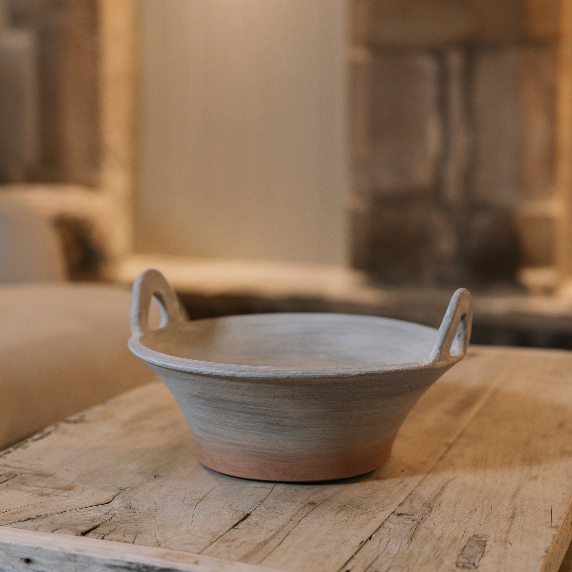Eli Terracotta Decorative Bowl on wooden table.