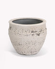 Large outdoor planter with a textured surface on a white background