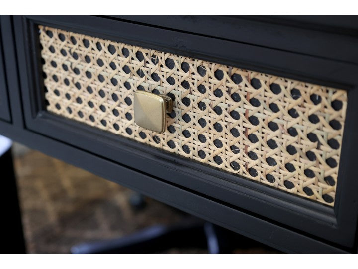 Close up of rattan front drawer in wooden desk.