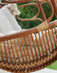 Close up off woven rattan detail on hanging egg swing chair.