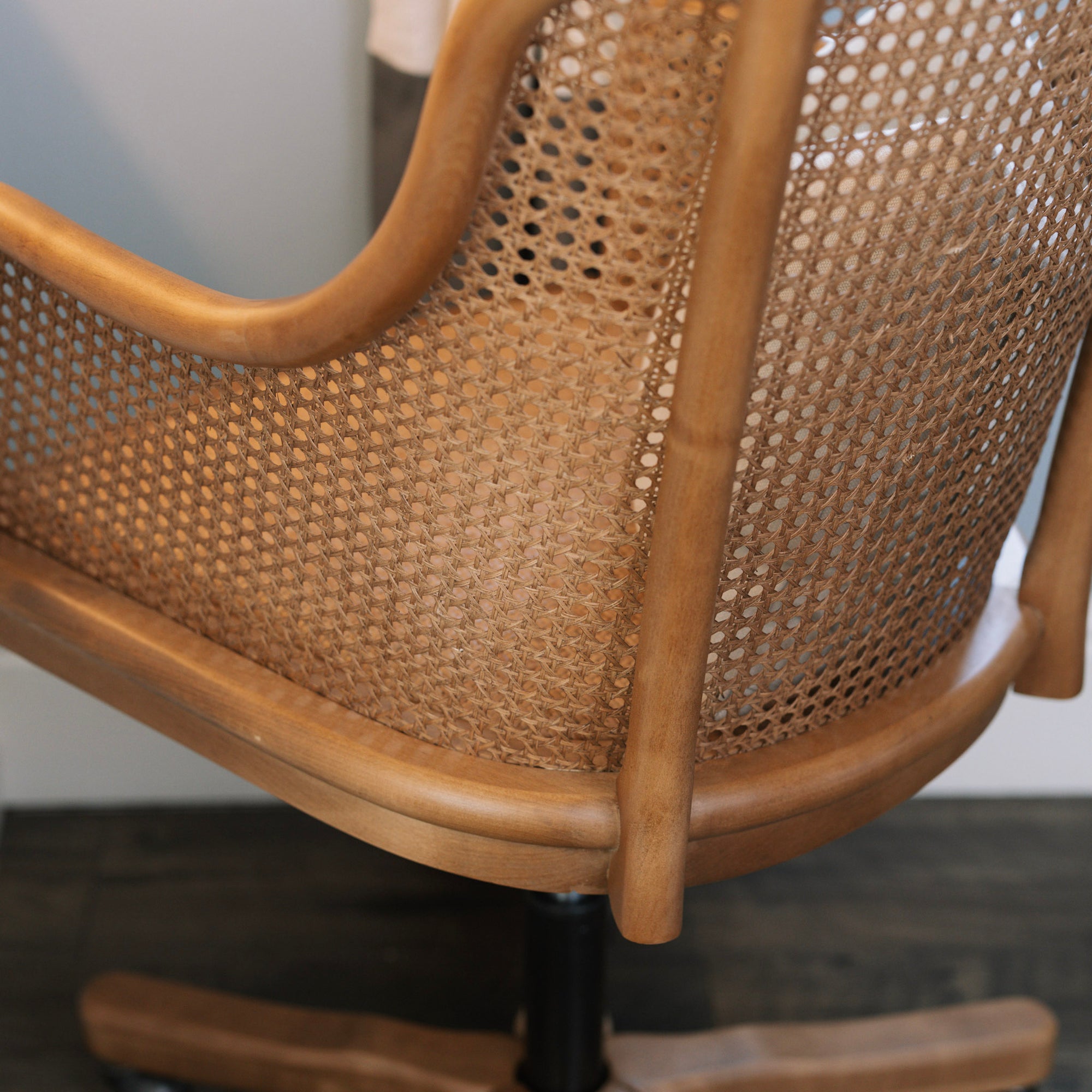 Natural rattan wicker office chair with cane back.