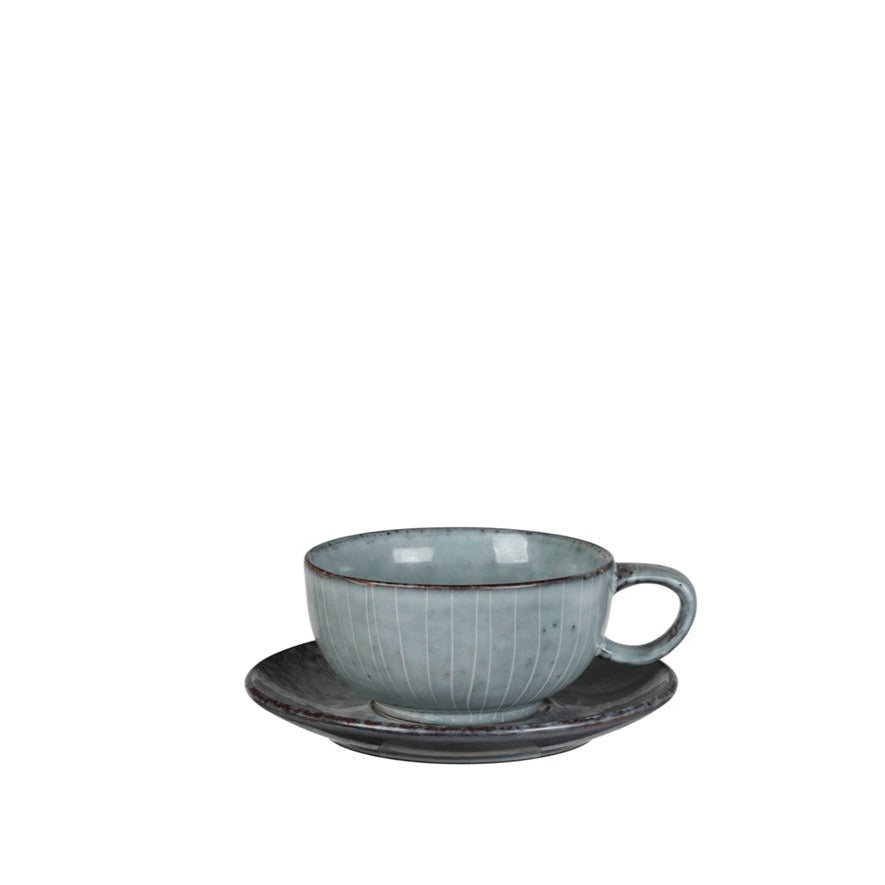 Blue glazed cappuccino cup with saucer.