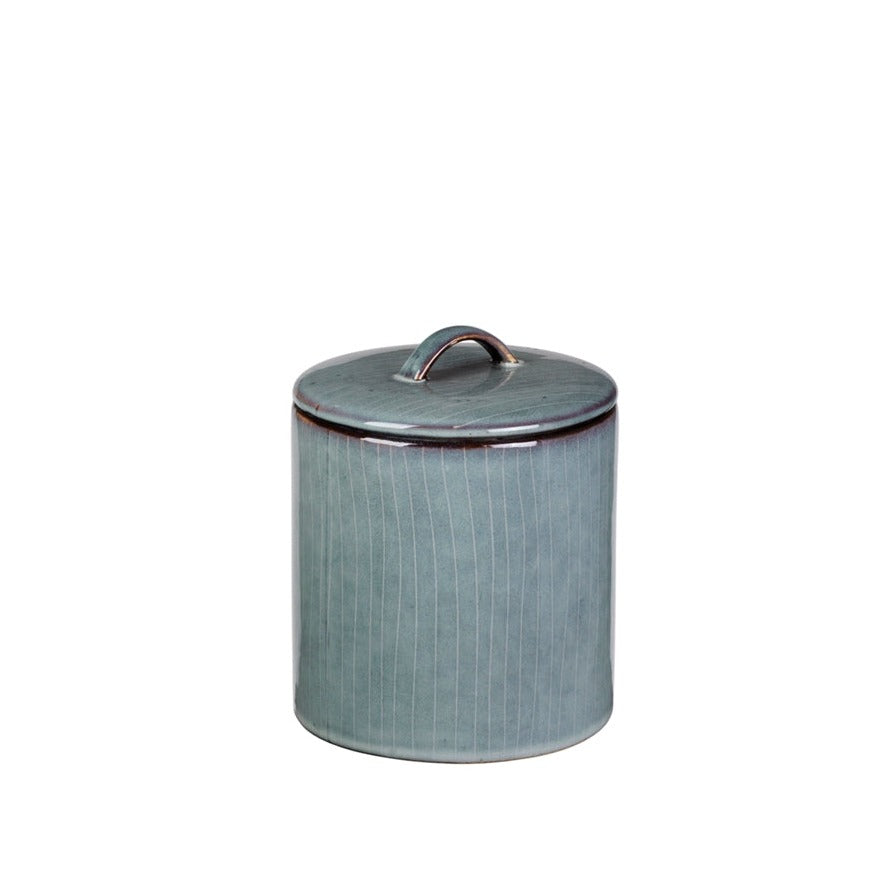 Blue glazed striped jar with lid and small handle.