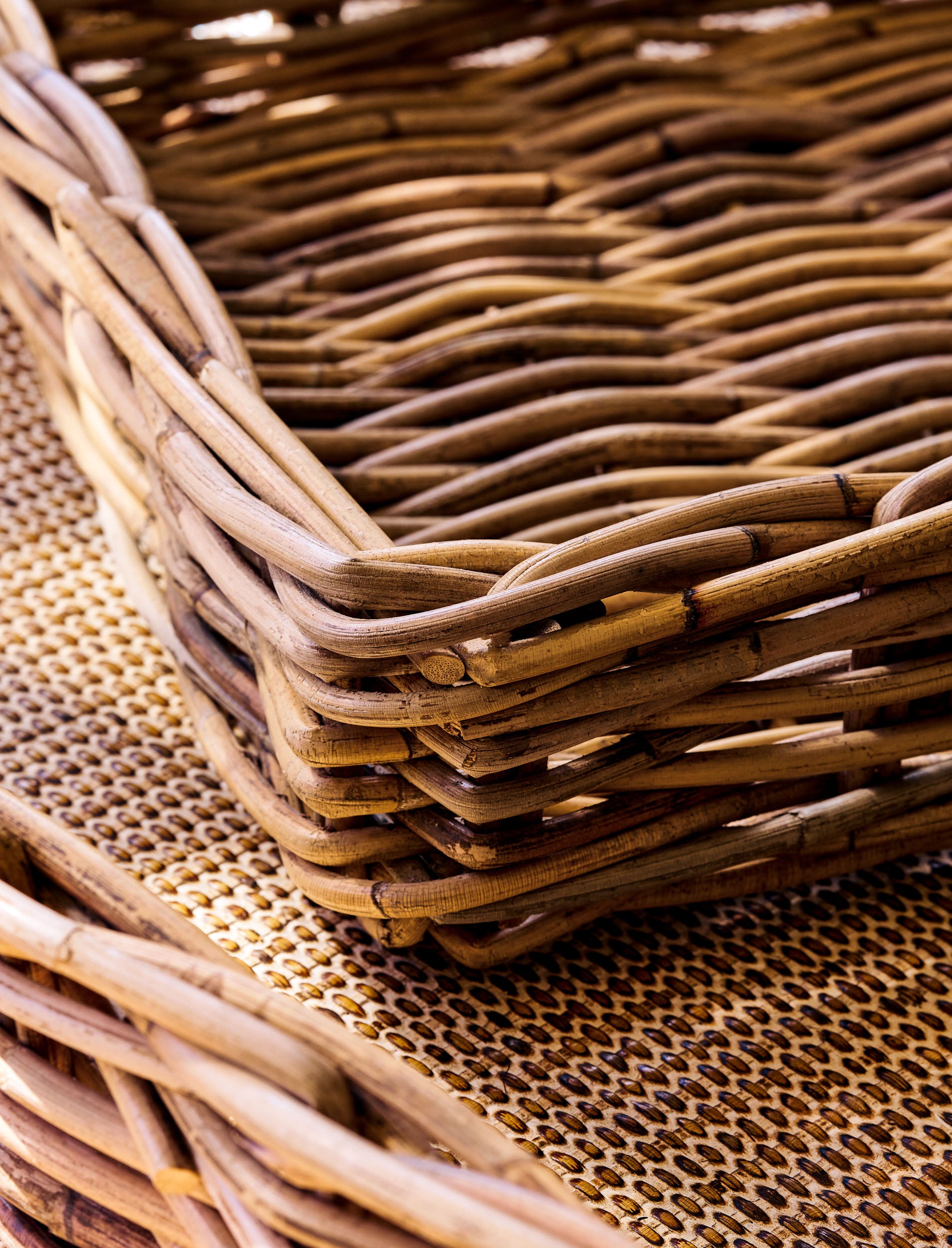 Close-up of a natural woven trays on a textured surface