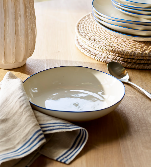 Blue and white stoneware pasta bowls with spoon.