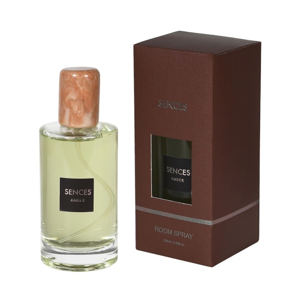 Glass room spray with brown label and brown presentation box.