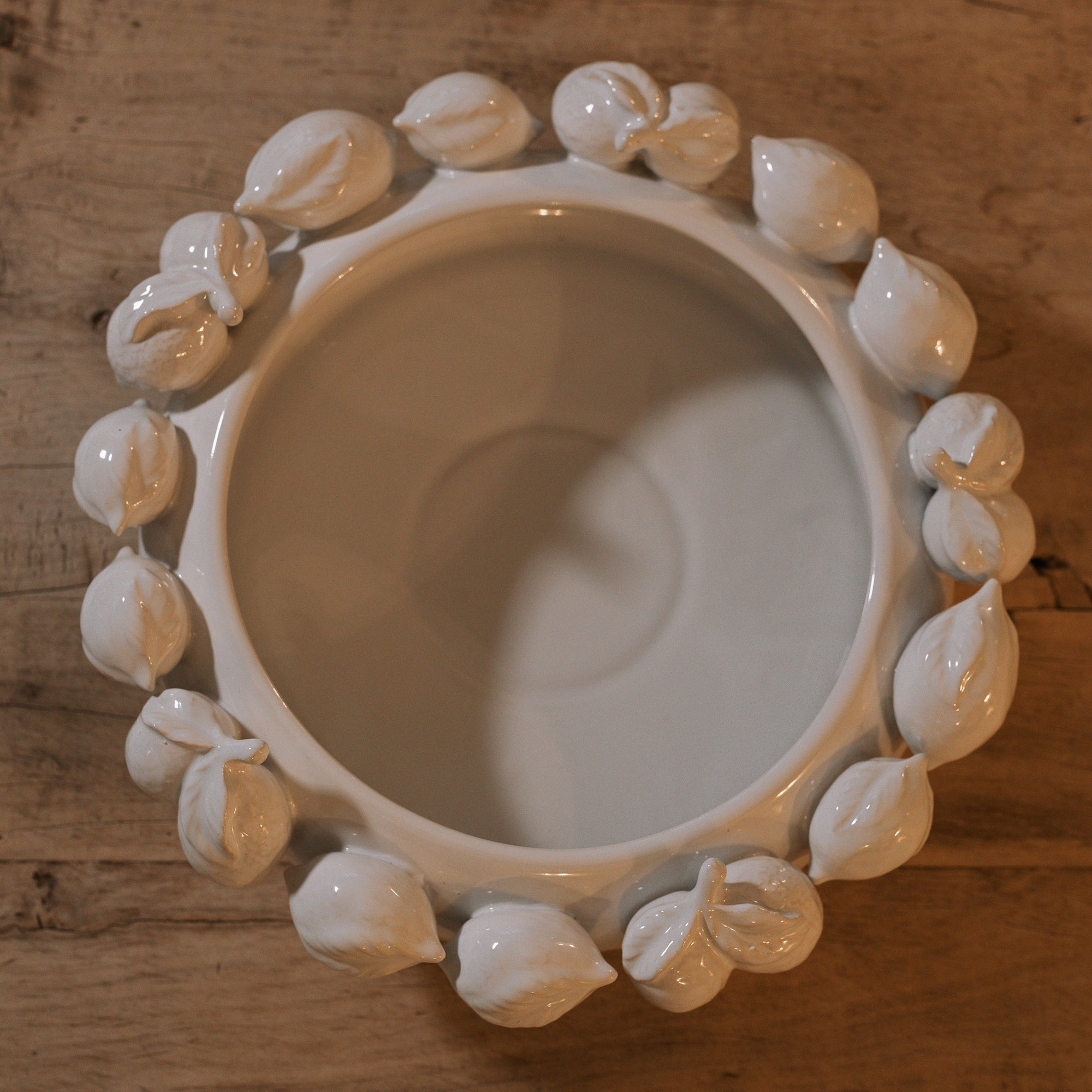 White ceramic bowl with decorative lemons, shot from above.
