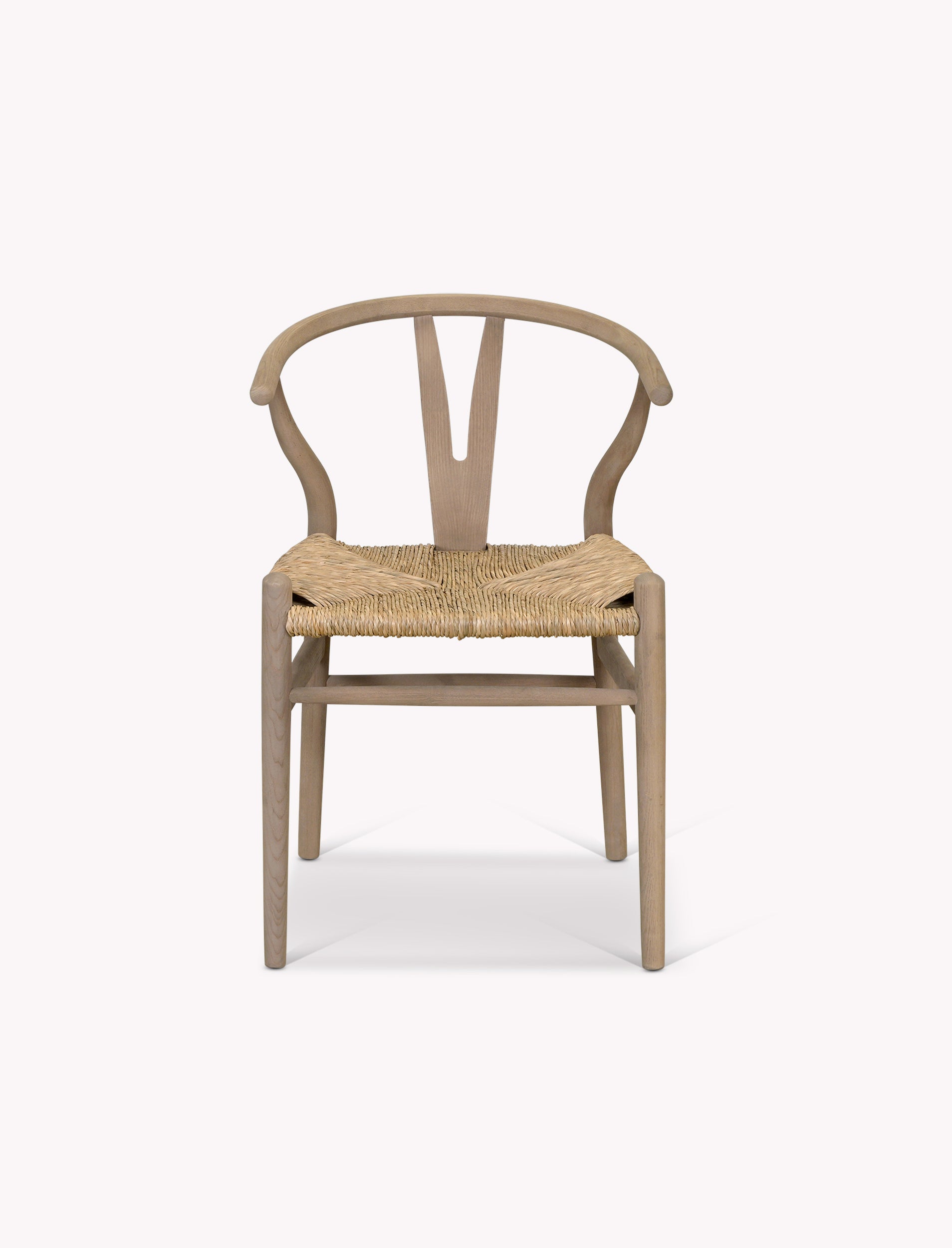 Wishbone dining chairs  with woven seat on a white background