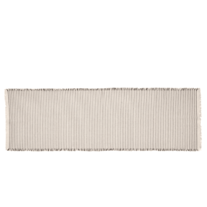 This striking table runner is brought to you from Broste Copenhagen and its combines both style and practicality. This table runner Is finished in an off white and black colour.