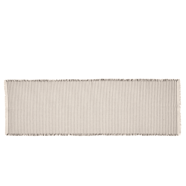 This striking table runner is brought to you from Broste Copenhagen and its combines both style and practicality. This table runner Is finished in an off white and black colour.
