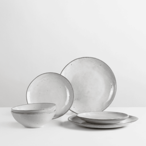 Transform your dining experience with the Nordic Sand Dinner Set for Two by Broste Copenhagen. This set includes two dinner plates, two side plates, and two bowls. 