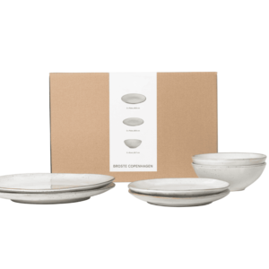 Transform your dining experience with the Nordic Sand Dinner Set for Two by Broste Copenhagen. This set includes two dinner plates, two side plates, and two bowls. 