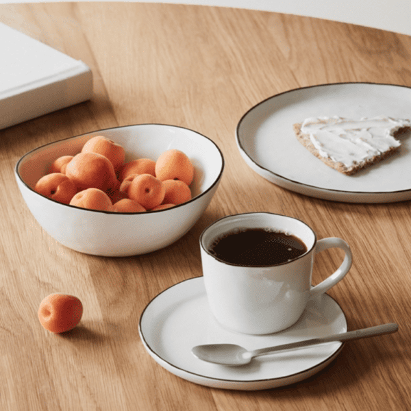 Introducing the Salt Breakfast Set for Four by Broste Copenhagen. This set includes four plates, four bowls and four cups with saucers.