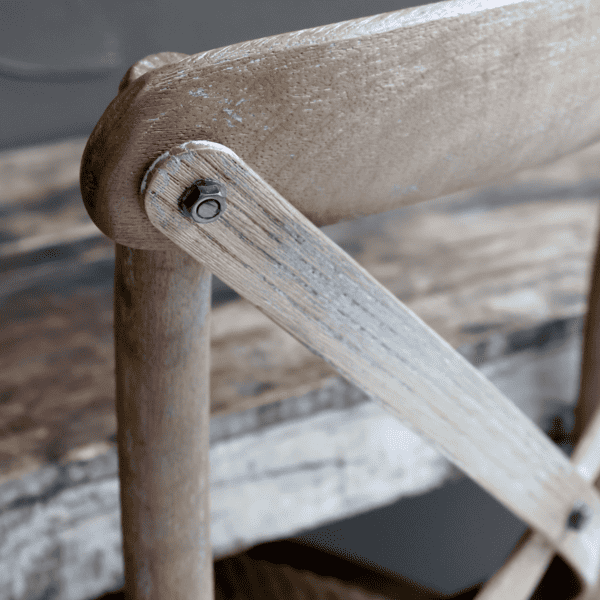 White washed wood of a dining chair.