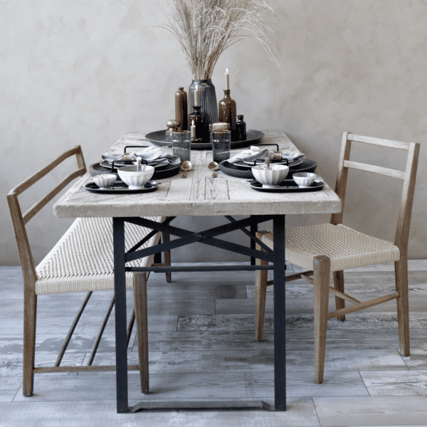 Rustic dining scene, pampas grass, wicker dining chair.