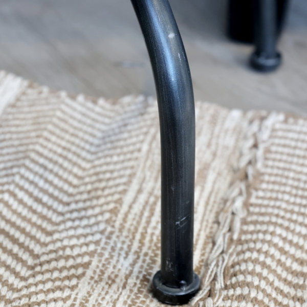 Part of the factory collection. Antique black iron stool with a swivel feature.