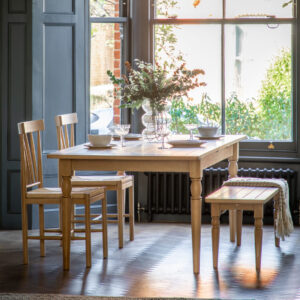 Offering farmhouse charm, this extending dining table is the perfect addition to any interior. Featuring solid oak underframe, turned spindle legs and a grooved & planked oak top that gives a traditional and rustic feel. Thanks to the easy to use metal extension pull table leaf, the table can easily be extended to seat up to 10 people.