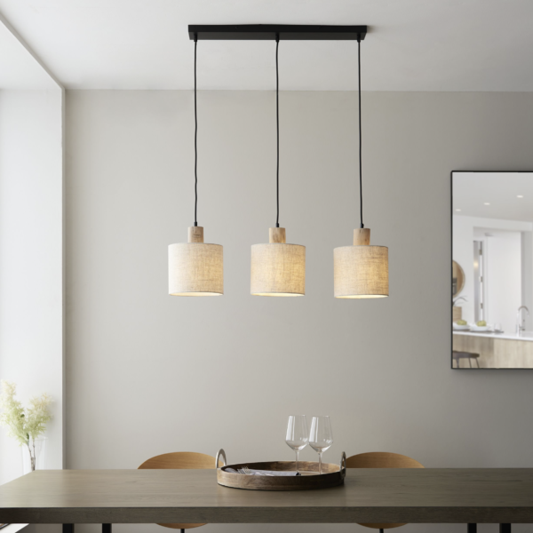 Scandi inspired linear pendant ideal for using above a breakfast bar or table. Natural wood and natural linen shade creates a cosy glow.