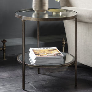 Striking round companion table in an aged bronze finish.