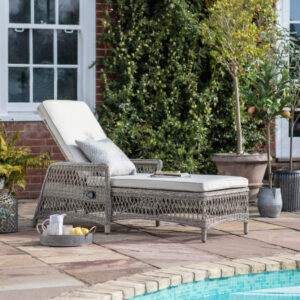 Beautiful rattan sun lounger with a showerproof cushion. Finished in a soft stone colour.