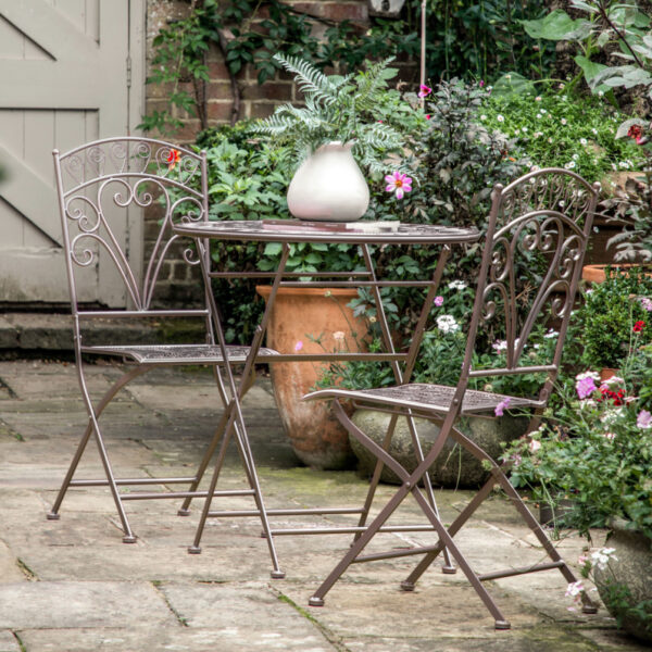 Ideal for balconies, smaller outdoor spaces and cosy garden corners, this lovely set offers a bistro cafe style. Crafted from metal in a lovely deep metal patina finish, the design is inspired by nature, with the pattern on the table top and chair seats evocative of leaves and trees.