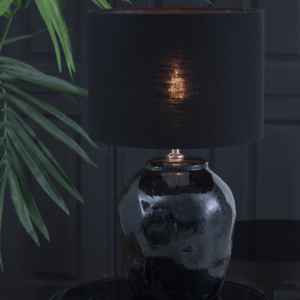 Round table lamp made from fine ceramics. Finished in a sleek matt black colour. Lampshade not included.