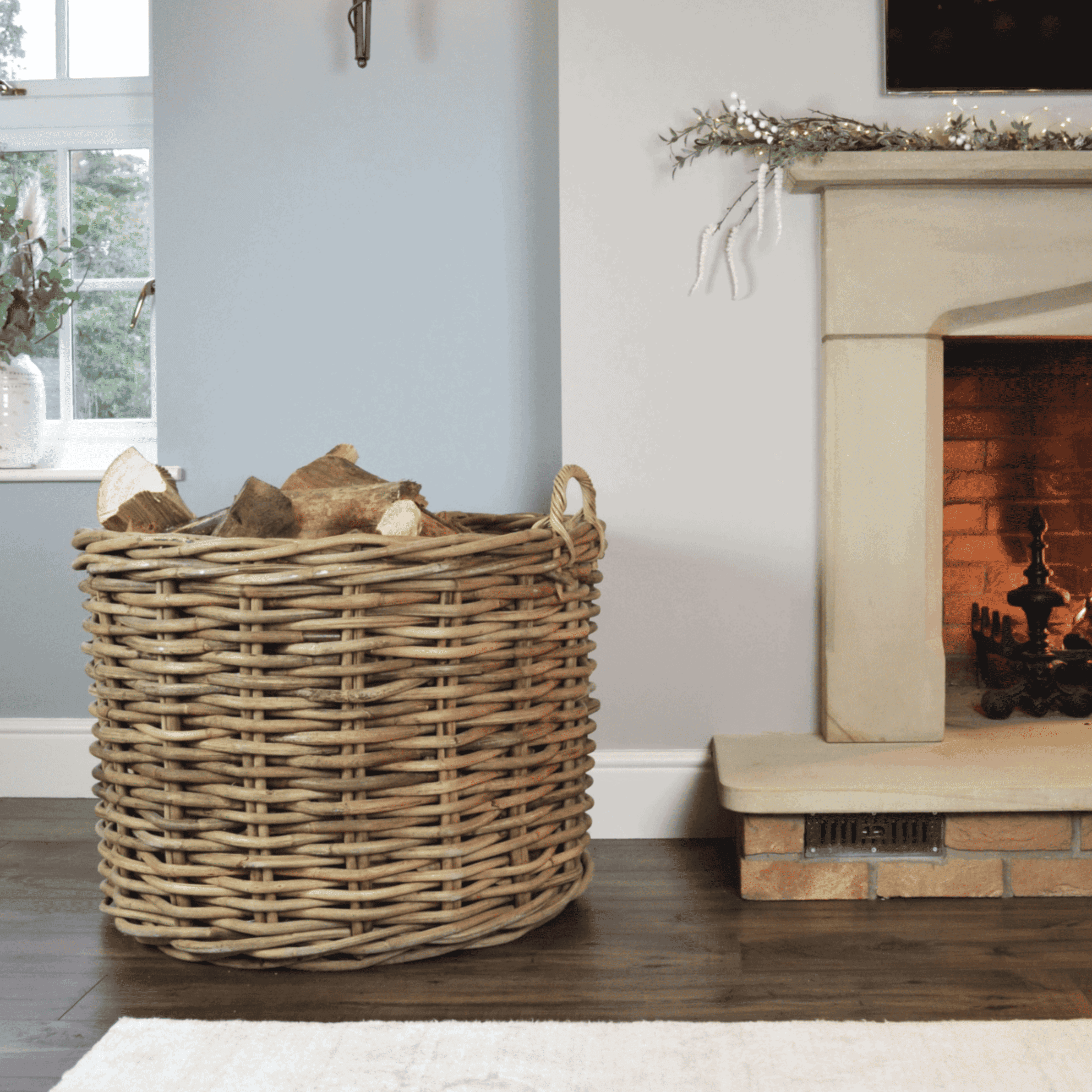 A stylish rattan basket, perfect for housing your firewood, baskets or even books. 