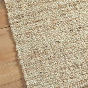 A beautiful rug made from wool and cotton. Handcrafted and finished in an earthy colour palette.