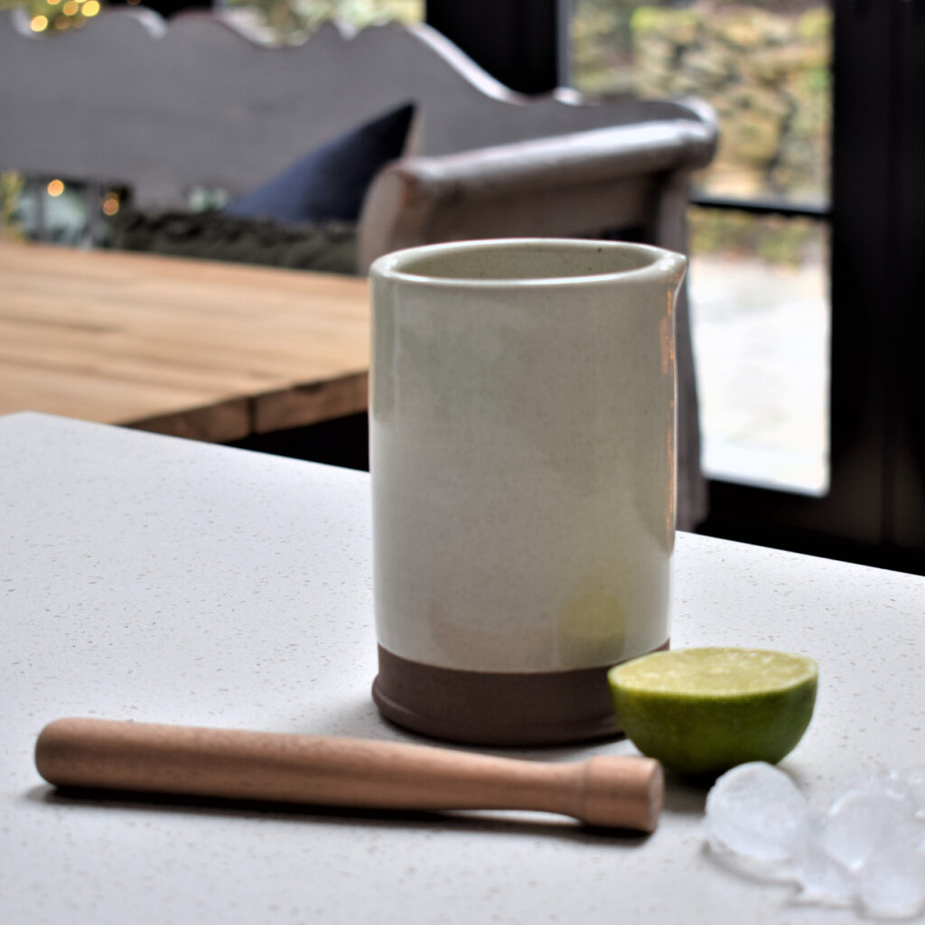 stoneware cocktail jug with wooden muddler. Finished in a milk white finish. Perfect for a home bar.