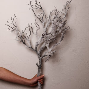 A faux twig branch topped with snow. Crafted with lifelike perfection, its ideal for the upcoming season.