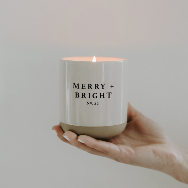 Sweet Water Decor Merry & Bright Candle in hand lit
