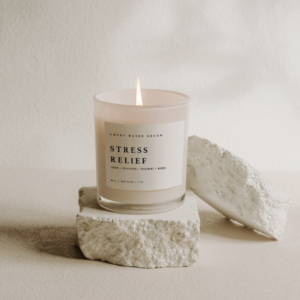 Stress Relief Soy Candle In White Jar Product Shoot On Rocks