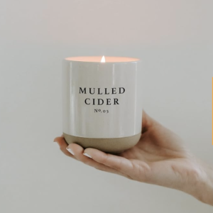 Sweet Water Decor Mulled Cider Soy Candle In Stoneware Jar help up and lit
